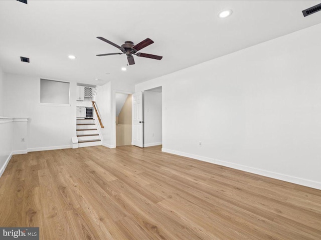 unfurnished living room with ceiling fan and light hardwood / wood-style floors