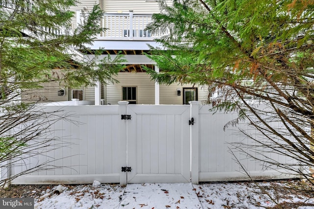 view of snow covered gate