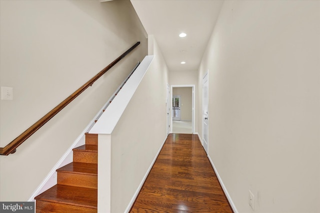 hallway with dark wood-type flooring