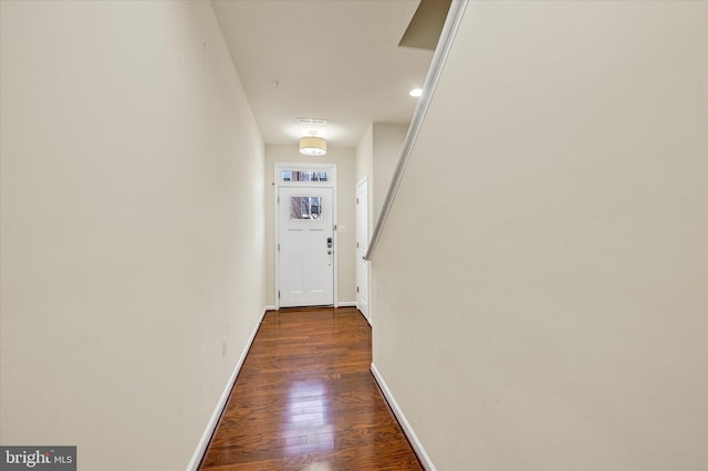 doorway to outside with dark wood-type flooring