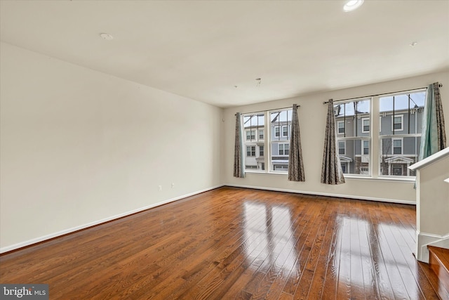 empty room with wood-type flooring