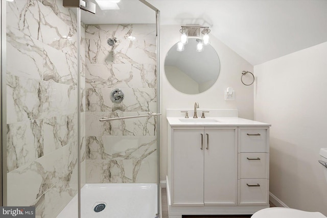 bathroom featuring vanity, toilet, lofted ceiling, and a shower with door