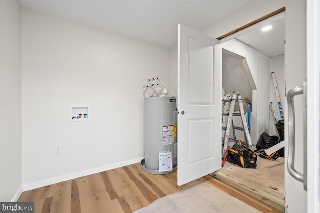 utility room with electric water heater