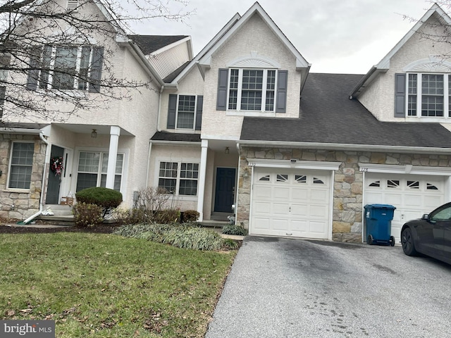 view of front of home featuring a garage and a front lawn