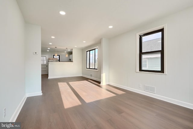 unfurnished room featuring dark hardwood / wood-style flooring