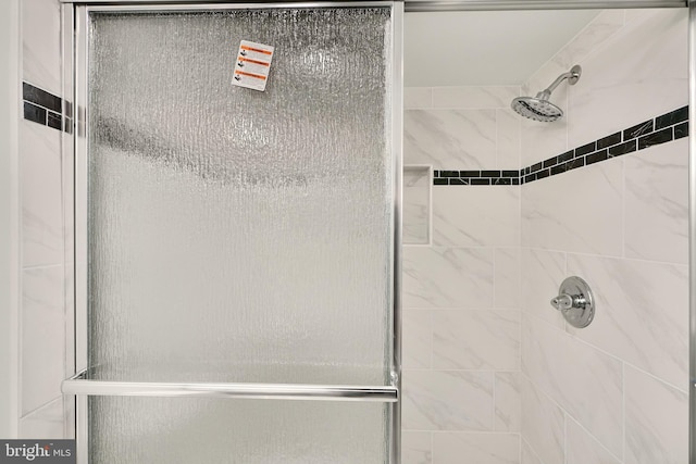 bathroom with an enclosed shower