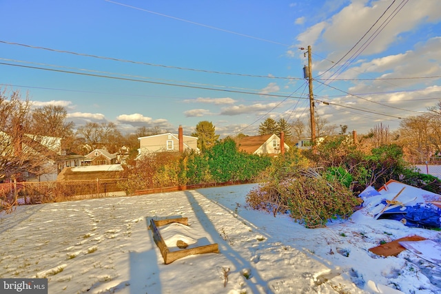 view of yard layered in snow