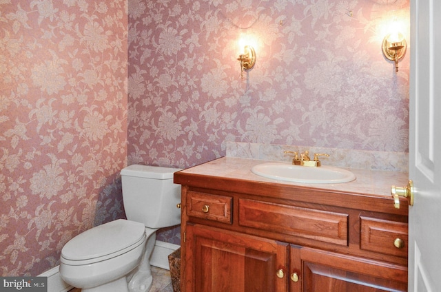 bathroom with toilet and vanity