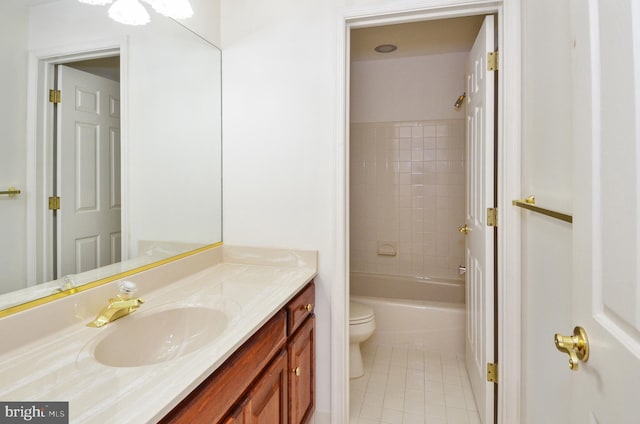 bathroom featuring vanity, bathtub / shower combination, toilet, and tile patterned flooring