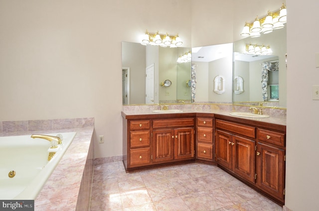 bathroom with tiled bath, tile patterned floors, and vanity