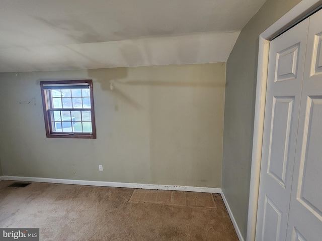 bonus room featuring carpet and lofted ceiling