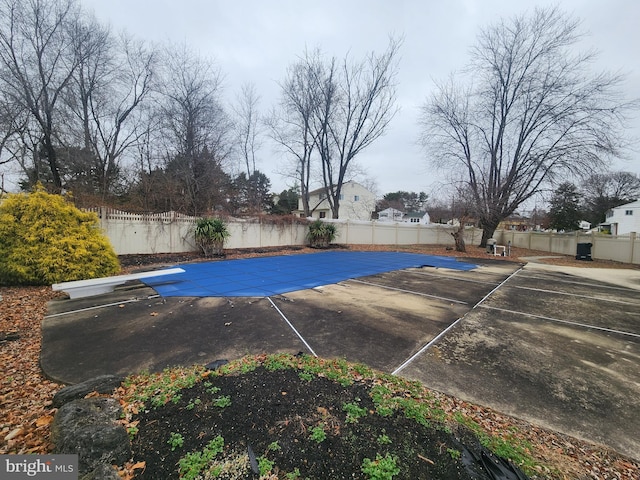 exterior space with a diving board and a patio area