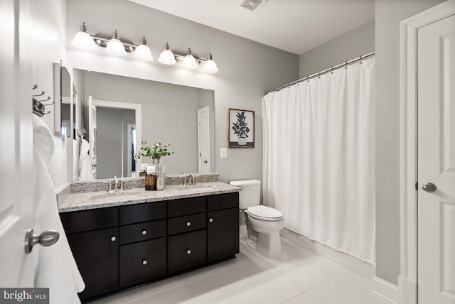 bathroom featuring tile patterned flooring, vanity, a shower with shower curtain, and toilet