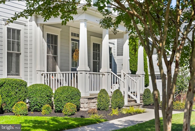 doorway to property with covered porch