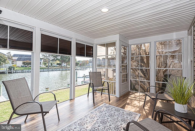 sunroom with a water view