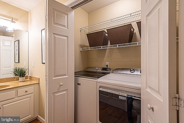 washroom featuring sink and washer and clothes dryer