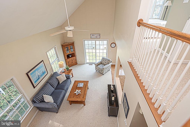 living room featuring ceiling fan, high vaulted ceiling, and carpet floors