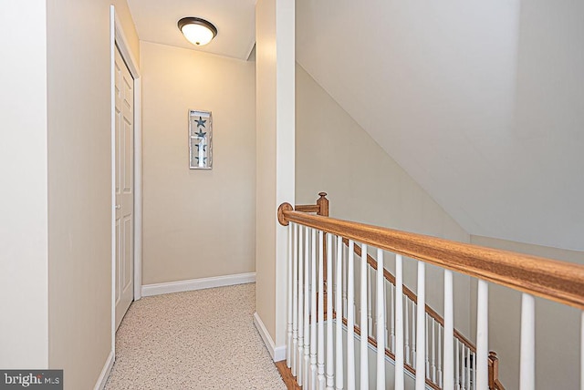 hall with vaulted ceiling