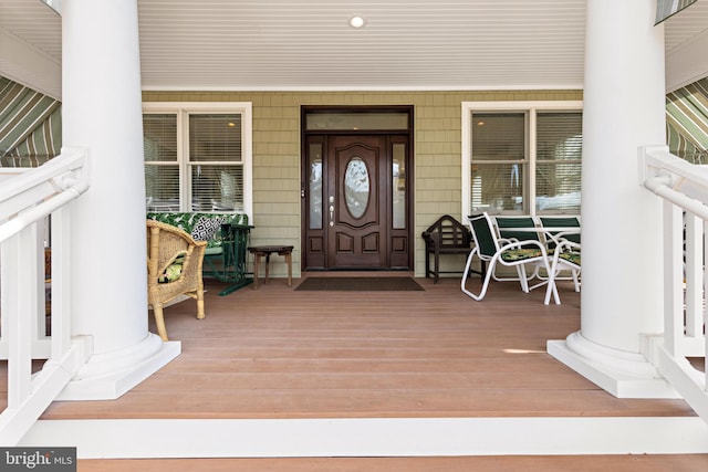 property entrance with covered porch