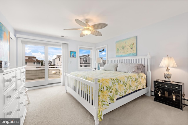 bedroom featuring ceiling fan, access to exterior, and light carpet