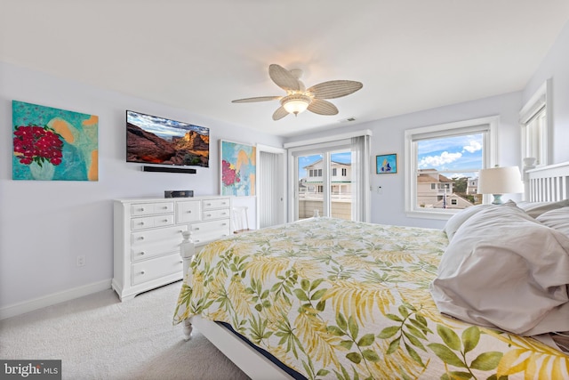 carpeted bedroom with access to exterior and ceiling fan