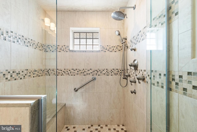 bathroom with tiled shower