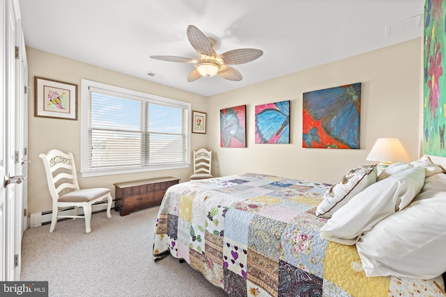 carpeted bedroom featuring ceiling fan and a baseboard heating unit