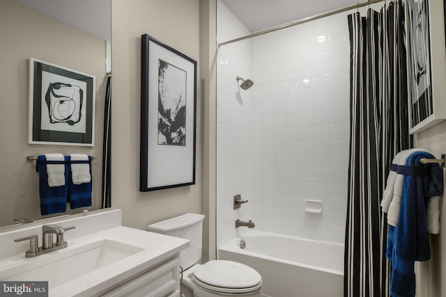 full bathroom with toilet, vanity, and shower / tub combo with curtain