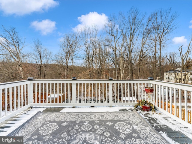 view of snow covered deck