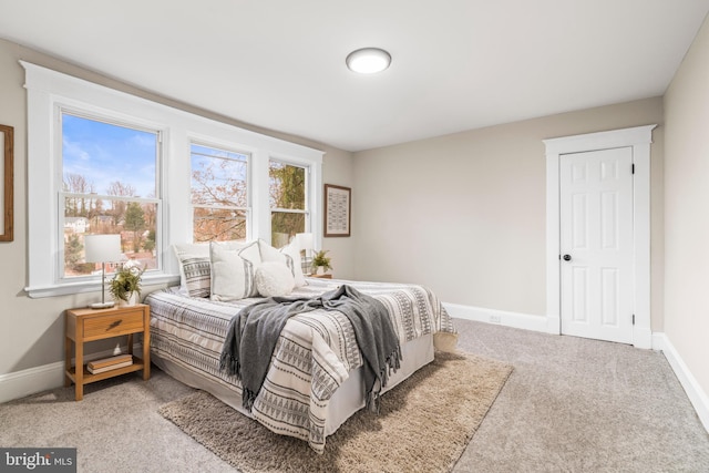 bedroom with light carpet