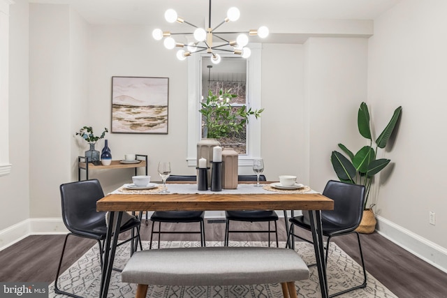 dining space featuring hardwood / wood-style floors and an inviting chandelier