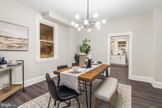 dining space with dark hardwood / wood-style flooring and a chandelier