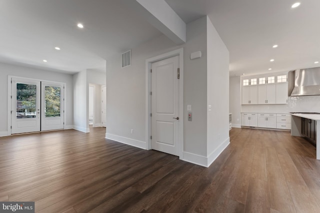 unfurnished living room featuring hardwood / wood-style floors