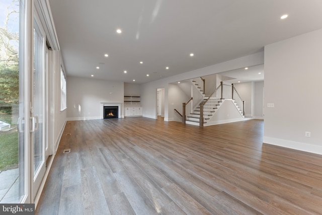 unfurnished living room with light wood-type flooring