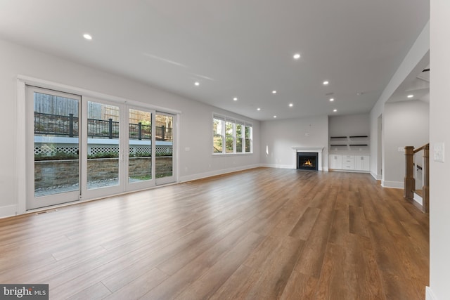 unfurnished living room with light hardwood / wood-style flooring