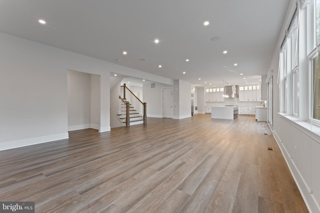 unfurnished living room featuring light wood-type flooring