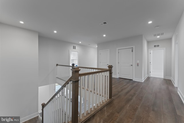 corridor with dark hardwood / wood-style floors