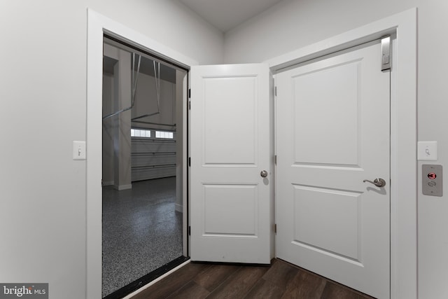 hall with dark hardwood / wood-style flooring