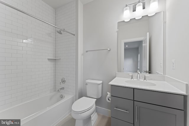 full bathroom with tiled shower / bath combo, toilet, and vanity