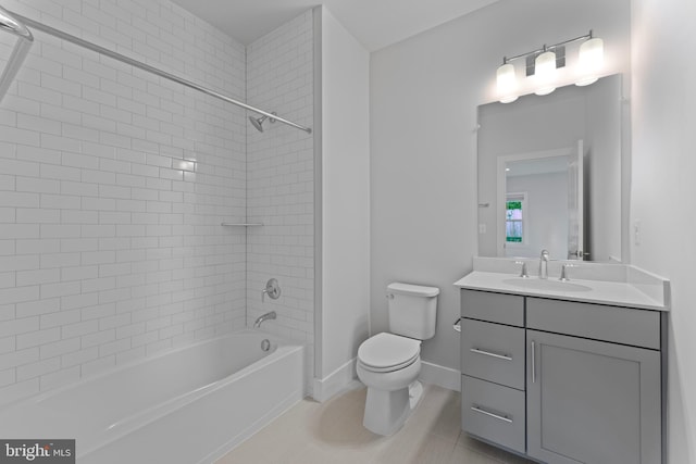 full bathroom with tile patterned flooring, vanity, toilet, and tiled shower / bath