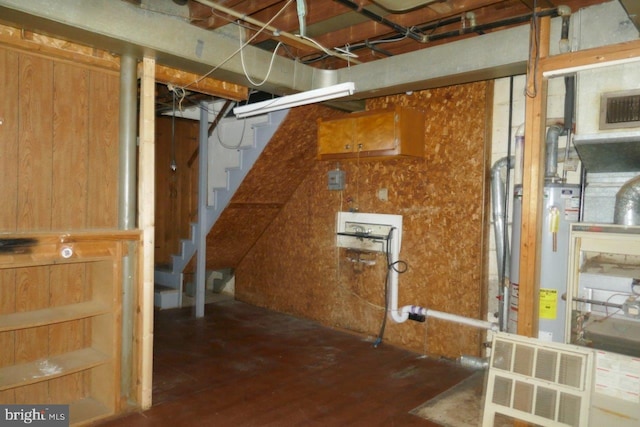 basement featuring gas water heater