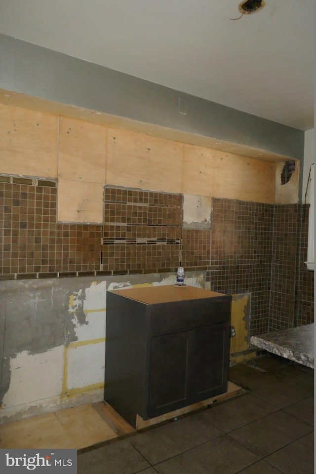 bathroom with tile walls