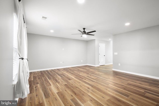 unfurnished room featuring hardwood / wood-style flooring and ceiling fan