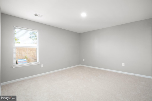 unfurnished room with carpet flooring