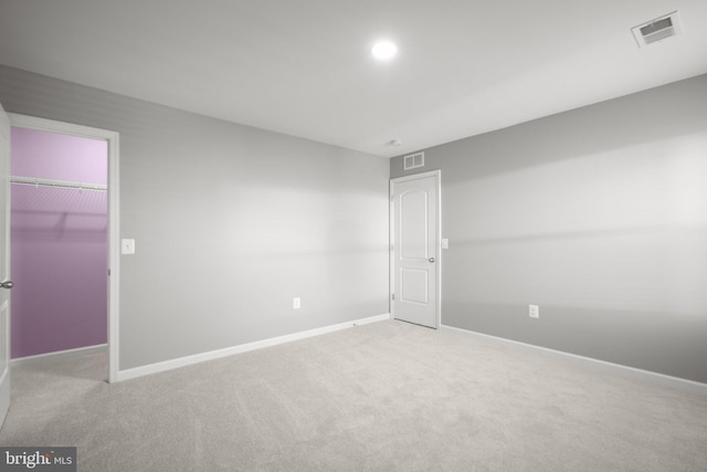 empty room featuring light colored carpet