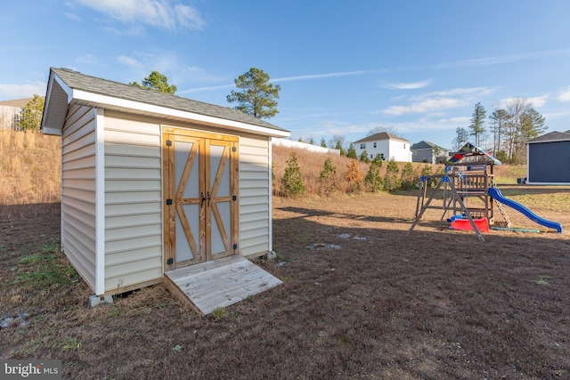 view of outbuilding with a playground