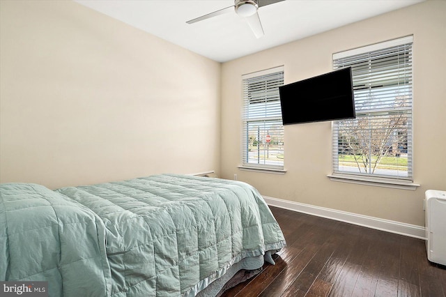 bedroom with ceiling fan and dark wood-type flooring