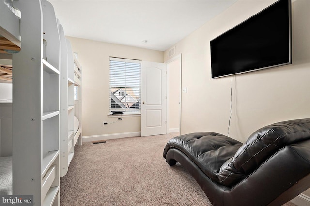 sitting room with light colored carpet