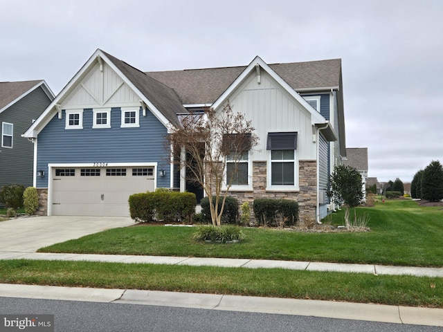 view of front of home featuring a front lawn and a garage