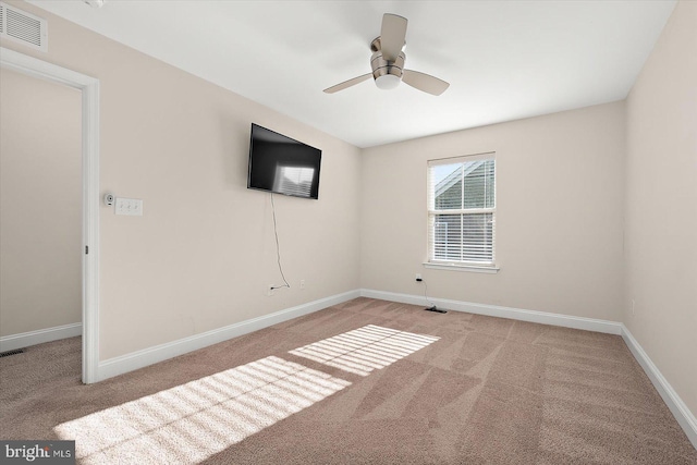 carpeted empty room with ceiling fan